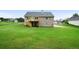 Large grassy backyard features a wooden deck and mature trees at 137 Cambridge Pointe, Villa Rica, GA 30180