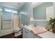 Bathroom featuring a shower, single sink vanity, and great natural light at 137 Cambridge Pointe, Villa Rica, GA 30180