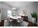 Bright dining room with vaulted ceiling, modern chandelier, dining table, and decor at 137 Cambridge Pointe, Villa Rica, GA 30180