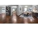 Dining room with wood floors next to an open kitchen area at 137 Cambridge Pointe, Villa Rica, GA 30180
