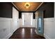 Home foyer featuring wood floors and ceiling, and custom cabinet at 137 Cambridge Pointe, Villa Rica, GA 30180