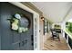 Charming front porch with rocking chairs, wreath, and address number at 137 Cambridge Pointe, Villa Rica, GA 30180