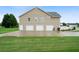 Large three-car garage with an extended driveway and ample parking at 137 Cambridge Pointe, Villa Rica, GA 30180