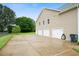 Attached three-car garage features lots of parking space at 137 Cambridge Pointe, Villa Rica, GA 30180
