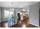 Well-lit kitchen features white cabinets, stainless steel appliances, and a wooden kitchen island at 137 Cambridge Pointe, Villa Rica, GA 30180