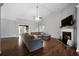 Spacious living room with fireplace, wood floors, and vaulted ceilings at 137 Cambridge Pointe, Villa Rica, GA 30180