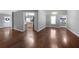 Bright living room boasting hardwood floors, neutral paint, and ample natural light at 137 Cambridge Pointe, Villa Rica, GA 30180