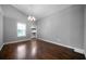Spacious room with a large window, hardwood floors and neutral wall color at 137 Cambridge Pointe, Villa Rica, GA 30180