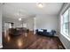 Spacious living room featuring vaulted ceiling, hardwood floors, and lots of natural light at 137 Cambridge Pointe, Villa Rica, GA 30180