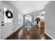 Inviting living room leading into the dining area and kitchen with hardwood floors and neutral paint at 137 Cambridge Pointe, Villa Rica, GA 30180