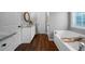 Bathroom featuring double sinks, a soaking tub, and great natural light at 137 Cambridge Pointe, Villa Rica, GA 30180