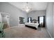 Spacious main bedroom features a vaulted ceiling, neutral colors, and large windows at 137 Cambridge Pointe, Villa Rica, GA 30180