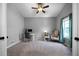 Bright home office with neutral walls, a ceiling fan, and a large window for natural light at 137 Cambridge Pointe, Villa Rica, GA 30180