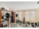 Basement workout area with gym equipment, mirrored wall, and rubber flooring at 2549 Emerald Dr, Jonesboro, GA 30236