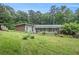 Charming single-story home with brick accents and mature trees on a spacious, gently sloping lawn at 2549 Emerald Dr, Jonesboro, GA 30236