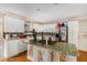 Bright kitchen with white cabinets, center island cooktop, and stainless steel appliances at 2549 Emerald Dr, Jonesboro, GA 30236