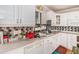 Bright kitchen features white cabinets, tiled backsplash, and modern appliances at 2549 Emerald Dr, Jonesboro, GA 30236