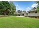 Large, grassy backyard with a patio, perfect for outdoor entertaining and relaxation at 3019 Haverford Se Ln, Marietta, GA 30067