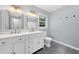 Modern bathroom with double sink vanity, granite countertops, and tiled floor at 3019 Haverford Se Ln, Marietta, GA 30067