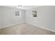 Bedroom with neutral walls, tile floor and two windows at 3019 Haverford Se Ln, Marietta, GA 30067