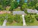 Charming single-story home featuring a well-manicured lawn, mature trees and a long driveway at 3019 Haverford Se Ln, Marietta, GA 30067