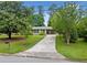 Inviting one-story home with mature trees, green lawn, and a long, private driveway at 3019 Haverford Se Ln, Marietta, GA 30067
