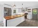 Bright kitchen featuring a stainless refrigerator, butcher block island and modern appliances at 3019 Haverford Se Ln, Marietta, GA 30067