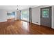 Living room featuring hardwood floors, large windows, neutral walls and a view to the entrance at 3019 Haverford Se Ln, Marietta, GA 30067