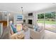 Cozy living room featuring a white brick fireplace, a modern TV, and comfortable seating area at 3019 Haverford Se Ln, Marietta, GA 30067