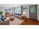 Cozy living room with stylish furniture, hardwood floors, and a view to the dining area at 3019 Haverford Se Ln, Marietta, GA 30067