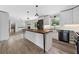 Open-concept living space showcasing butcher block island, modern kitchen and seamless flow at 3019 Haverford Se Ln, Marietta, GA 30067