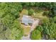Aerial view of home showcasing the roof, driveway, yard, mature trees, and location on a quiet street at 49 Timberlake Ne Cv, Cartersville, GA 30121