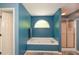 Bathroom showcasing a soaking tub, glass-enclosed shower, and a soothing blue color scheme at 49 Timberlake Ne Cv, Cartersville, GA 30121
