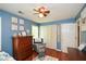 Bright Bedroom boasts cheerful decor, with a comfortable chair, wooden dresser and neutral carpeting at 49 Timberlake Ne Cv, Cartersville, GA 30121
