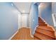 Hallway with wood staircase and flooring leading to multiple rooms at 49 Timberlake Ne Cv, Cartersville, GA 30121