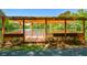 Wooden gazebo with lake view, offering a serene spot for relaxation and enjoying the natural scenery at 49 Timberlake Ne Cv, Cartersville, GA 30121
