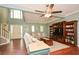 Spacious living room featuring wood floors, a large window, and comfortable seating at 49 Timberlake Ne Cv, Cartersville, GA 30121