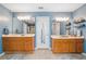 Elegant main bathroom with dual vanities, modern fixtures, a shower, and ample counter space for convenience at 49 Timberlake Ne Cv, Cartersville, GA 30121