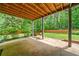 Cozy patio with garden and outdoor swing at 49 Timberlake Ne Cv, Cartersville, GA 30121