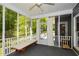 Relaxing screened porch featuring comfortable seating and serene wooded views at 49 Timberlake Ne Cv, Cartersville, GA 30121