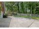 Spacious backyard with a basketball court and wooden fence; perfect for outdoor activities at 530 Veranda Ct, Alpharetta, GA 30009