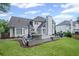 Beautiful backyard with a well-manicured lawn, patio, and outdoor dining area at 530 Veranda Ct, Alpharetta, GA 30009