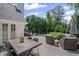 Relaxing backyard deck with dining and seating areas and beautiful landscaping at 530 Veranda Ct, Alpharetta, GA 30009