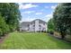 Expansive backyard showcasing a lush lawn, deck, and inviting outdoor seating at 530 Veranda Ct, Alpharetta, GA 30009