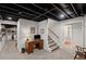 Finished basement area, featuring a desk, stairs, and view into bathroom space at 530 Veranda Ct, Alpharetta, GA 30009