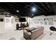 Cozy finished basement with a comfortable seating area and entertainment center at 530 Veranda Ct, Alpharetta, GA 30009