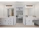 En suite bath with and vanities, sleek countertops and lighting at 530 Veranda Ct, Alpharetta, GA 30009