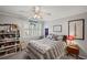 Cozy bedroom featuring a comfortable bed, book shelving, window, and neutral decor at 530 Veranda Ct, Alpharetta, GA 30009