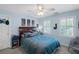 Comfortable bedroom with a window, blue walls, and ceiling fan at 530 Veranda Ct, Alpharetta, GA 30009