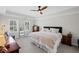 Spacious bedroom with tray ceiling, comfortable king bed and natural light at 530 Veranda Ct, Alpharetta, GA 30009